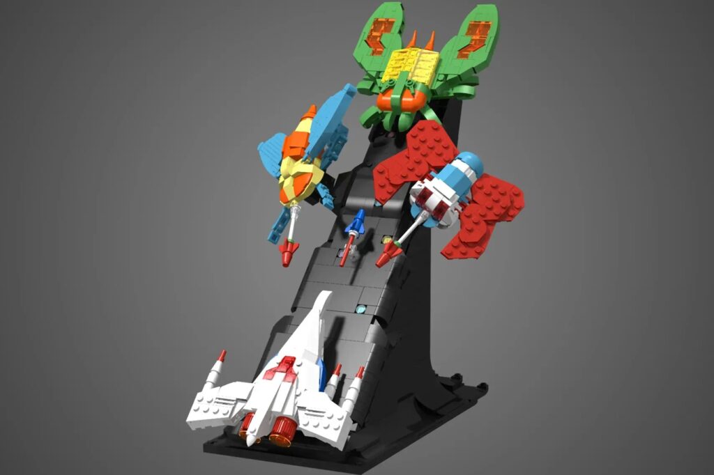 A minimalist LEGO set of the ship from the video game Galaga, facing upwards as it fires it's weapon at some bugs coming at it.